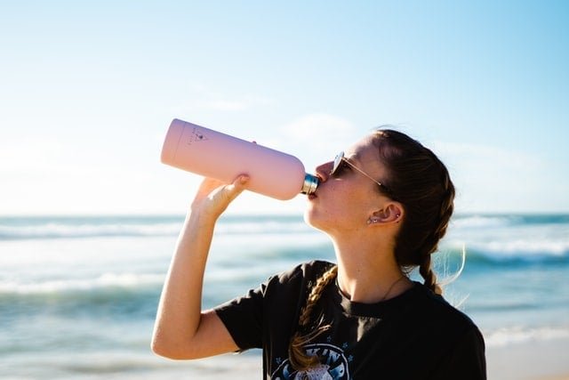 girl drinking electrolytes
