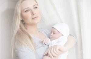 Cute mother with newborn baby