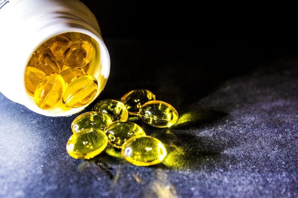 Omega Supplement Pills And Bottle