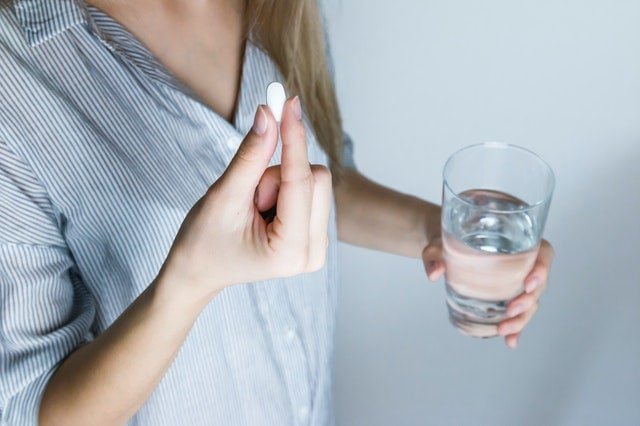 taking probiotic supplement