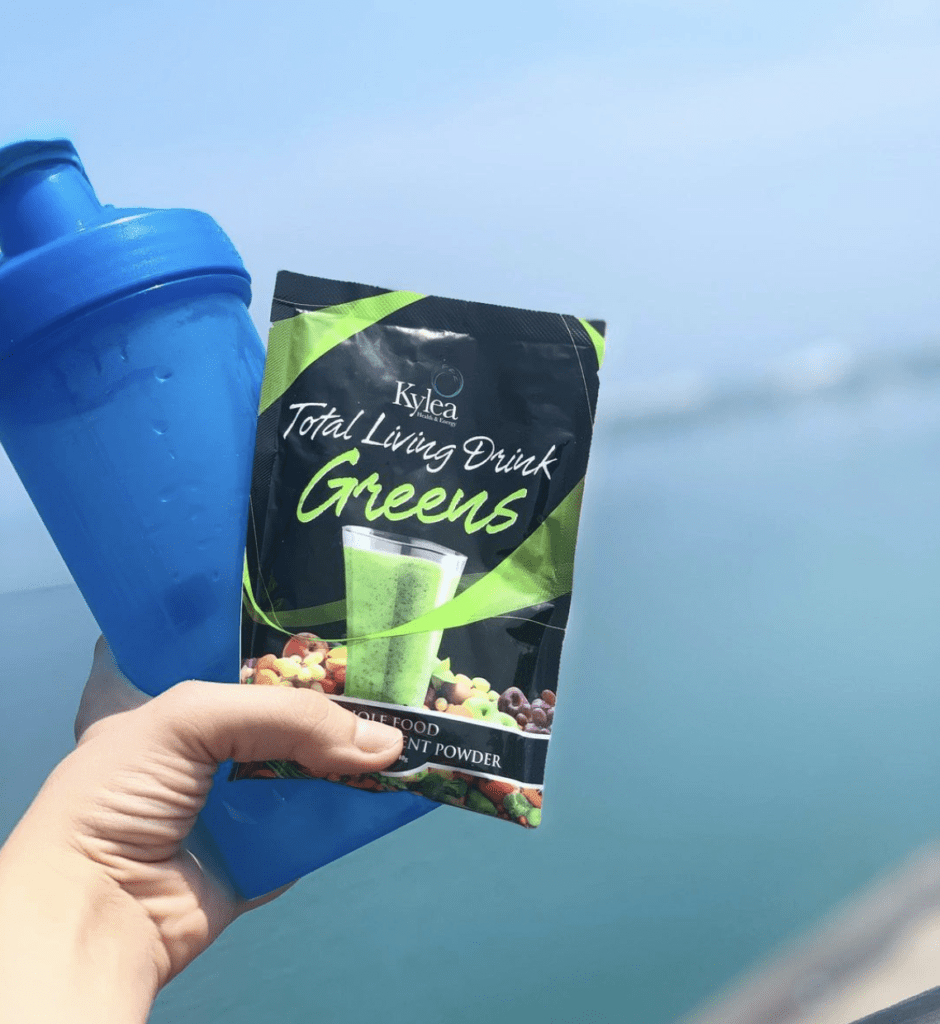 kylea total living drink greens and blue water bottle